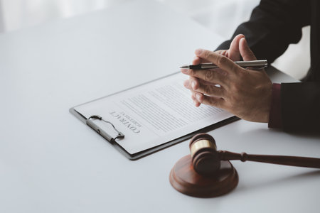 Lawyers, lawyers in the office and legal documents for use in arguing and planning cases for clients to win the case. Lawyer concept upholding the law and assisting clients in legal cases.の写真素材