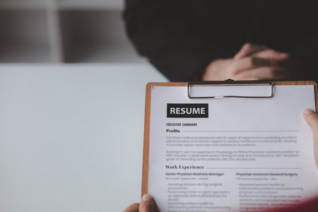 Person submitting resume to interview for a job with a company, Person attending a job interview...