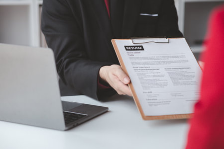 Person submitting resume to interview for a job with a company, Person attending a job interview...