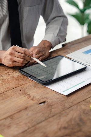The sales department is having a monthly summary meeting to bring it to the department manager, they are verifying the correctness of the documents that are prepared before bringing in to the managerの写真素材