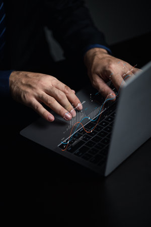 Businessman working with holograms showing business graphs and various information in work, using technology in business management for efficient work and modern business operations.の写真素材