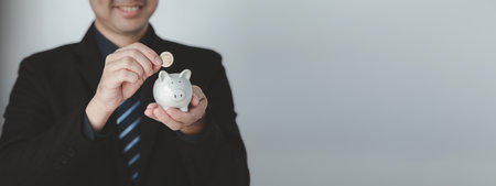 Individuals with savings, investing in stocks and funds to make money grow and generate profits in the future. The concept of personal finance and investment savings.の写真素材