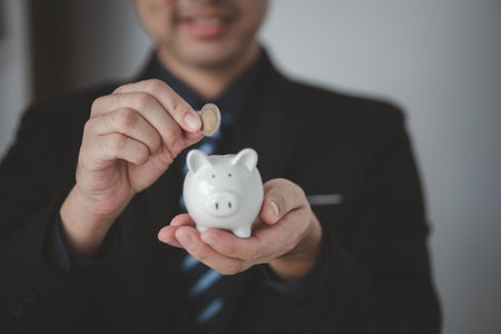 Individuals with savings, investing in stocks and funds to make money grow and generate profits in the future. The concept of personal finance and investment savings.の写真素材
