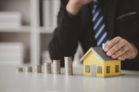 Individuals with savings, saving for the purchase of homes and real estate, personal financial planning and sharing expenses from income so that they can save and build on their future home purchases.の写真素材