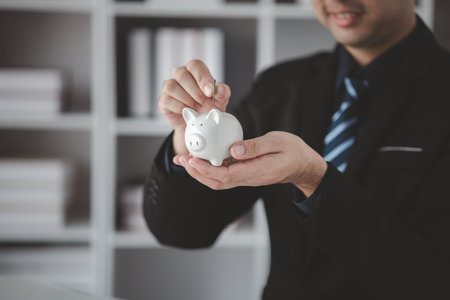 Individuals with savings, investing in stocks and funds to make money grow and generate profits in the future. The concept of personal finance and investment savings.の写真素材