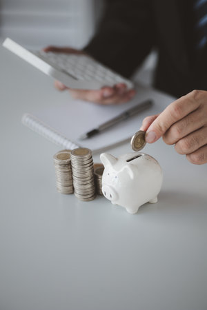 Individuals with savings, investing in stocks and funds to make money grow and generate profits in the future. The concept of personal finance and investment savings.の写真素材
