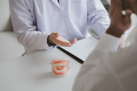 Dentists are providing dental treatment consultations to patients undergoing dental pain treatment,...
