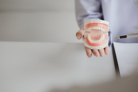 Dentists are providing dental treatment consultations to patients undergoing dental pain treatment,...