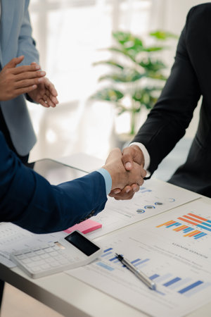 Two businessmen holding hands, Two businessmen are agreeing on business together and shaking hands...