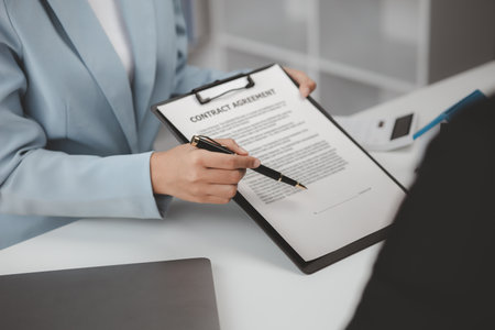 Real estate agents explain models of housing estates in projects to elaborate to clients, explaining and presenting information about homes and purchasing loans. Real estate trading concept.の写真素材