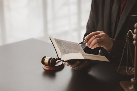 Lawyers read legal books defend their clients' cases, the lawyer concept assumes that the defendant defends the client in order to win the case or gain the greatest benefit in accordance with the law.の写真素材