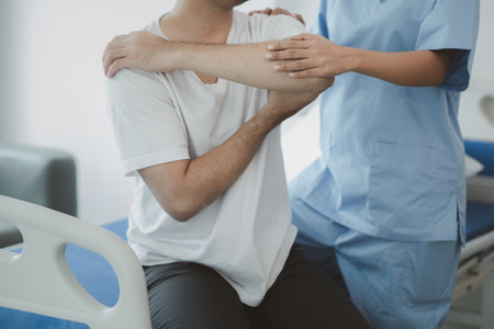 A physiotherapist doing physiotherapy for a patient in a hospital room, physiotherapy helps to...