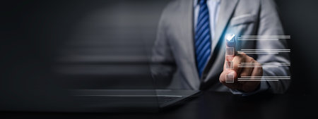 Person with hologram showing a list of options, businessman putting a check mark on an option in an online form on a website, showing a list of online questionnaires check the box. Checklist concept.の写真素材