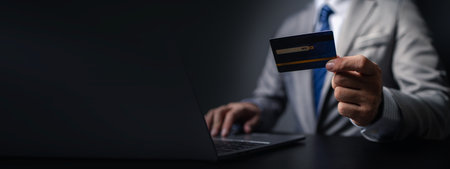 Man in suit with credit card, businessman hold credit card, using credit card to pay for goods and...
