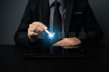 Person with hologram showing a list of options, businessman putting a check mark on an option in an online form on a website, showing a list of online questionnaires check the box. Checklist concept.の写真素材