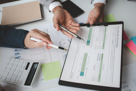 Atmosphere of a startup company meeting, business people are meeting together to summarize and plan investment finances, they are the founders of the company. Business administration concept.の写真素材