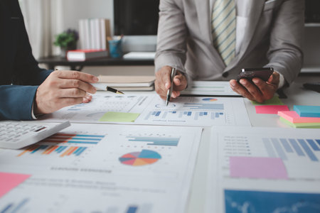 Atmosphere of a startup company meeting, business people are meeting together to summarize and plan investment finances, they are the founders of the company. Business administration concept.の写真素材