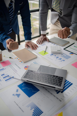 Meeting room atmosphere, business people meeting together on finance topics, they are working together to plan and solve corporate finance issues. Concept of business administration and finance.の写真素材