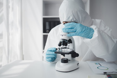 Lab practitioner working on chemical research for chemical reactions, does a chemical experiment and...