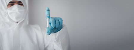 Lab practitioner working on chemical research for chemical reactions, does a chemical experiment and examines a patient's blood sample. Medicine and research concept.の写真素材