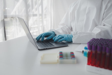 The laboratory is used for scientific research to test and research therapeutic vaccines, lab assistants collect blood samples from patients and perform chemical reactions. Laboratory concept.の写真素材