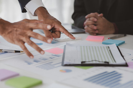 Atmosphere of a startup company meeting, business people are meeting together to summarize and plan investment finances, they are the founders of the company. Business administration concept.の写真素材