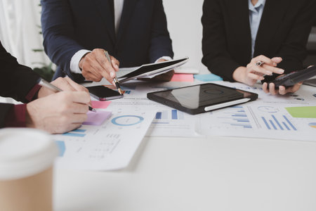 Atmosphere of a startup company meeting, business people are meeting together to summarize and plan investment finances, they are the founders of the company. Business administration concept.の写真素材