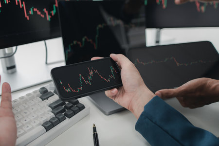 Two stock investors with stock market graph screen, stock fluctuation analysis, business man trading...