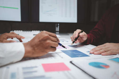 Atmosphere of a startup company meeting, business people are meeting together to summarize and plan investment finances, they are the founders of the company. Business administration concept.の写真素材