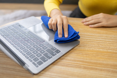 People are using laptop wipes on their desks, using cleaners and wipes on their desks, preventing...
