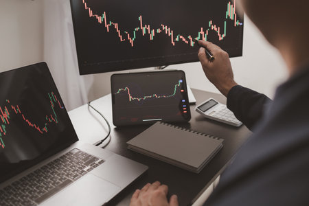 Person looking at stock chart, businessman stock investor trading stocks, stock market analysis for...