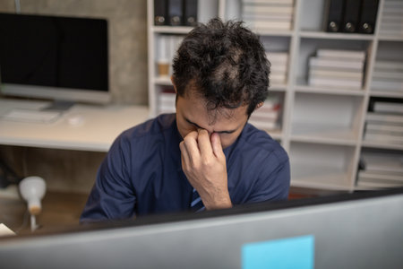 Startup company employees work overtime and work hard causing stress and fatigue from work, office...
