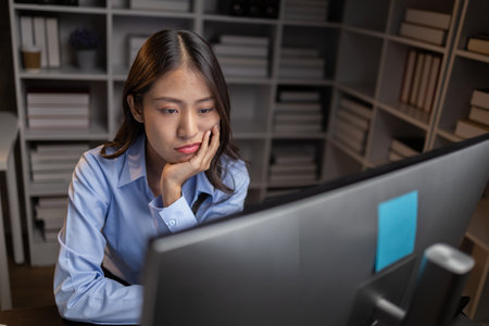 Company employees working overtime after work, working overtime after working hours due to heavy...