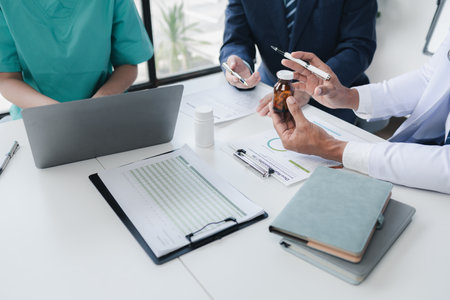 Joint meeting between doctors and administrators, meeting summarizing the prescription of medicines and importing medicines for use in hospitals, meeting to discuss together. Doctor meeting concept.の写真素材