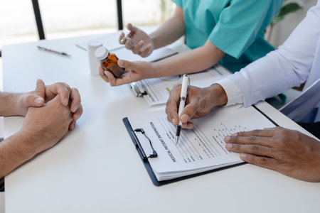 Doctors are treating patients who come to the hospital for examination, treating the disease by experts, analyzing the disease and giving advice on treatment. Concept of treating disease.の写真素材