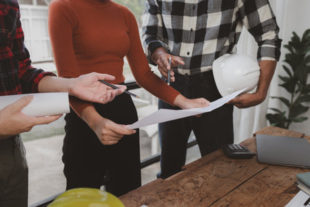 Group architects and engineers build houses and conference buildings together to design and build...