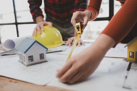 Group architects and engineers build houses and conference buildings together to design and build...