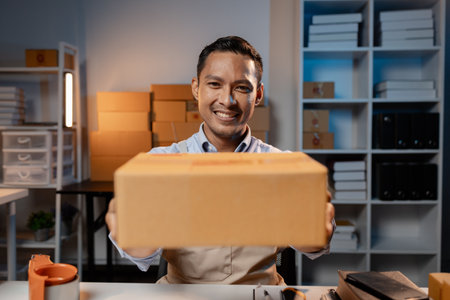 Asian business owners sell products on websites and online platforms. Business owners sell their...