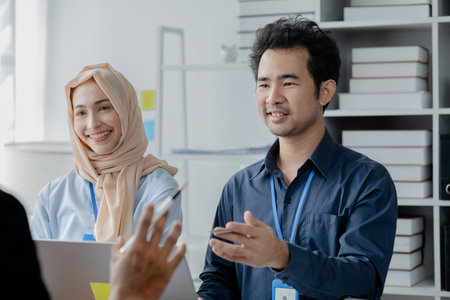 A startup company where young executives and employees work together, holding brainstorming sessions between bosses and employees to grow the business. Working concepts of the new generation.の写真素材