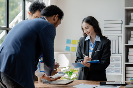 A group of businessmen and marketers meet in a company meeting room, a group of investors and executives plan marketing plans to find ways to make profits and grow. Marketing planning meeting ideas.の写真素材