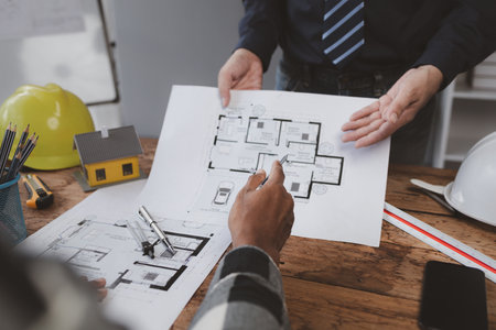 Architects and engineers jointly design and build houses, edit plans, design houses according to standards and structure them, and draw plans professionally. Ideas for designing and building a house.の写真素材