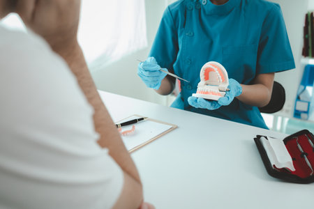 Man undergoes a dental checkup with professional dentist at dental clinic, undergoes a dental...