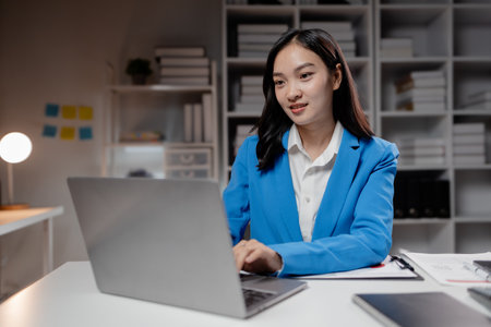 Business woman working in a startup company, female accountant working in auditing the company's accounts and finances, accounting and finance. Accounting and financial auditing concepts.の写真素材