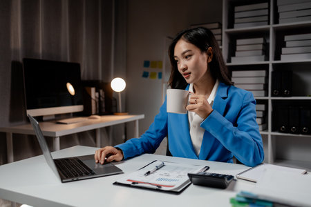 Business woman working in a startup company, female accountant working in auditing the company's accounts and finances, accounting and finance. Accounting and financial auditing concepts.の写真素材