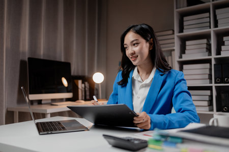Business woman working in a startup company, female accountant working in auditing the company's accounts and finances, accounting and finance. Accounting and financial auditing concepts.の写真素材