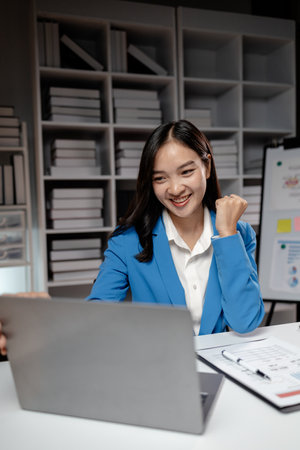Business woman working in a startup company, female accountant working in auditing the company's accounts and finances, accounting and finance. Accounting and financial auditing concepts.の写真素材