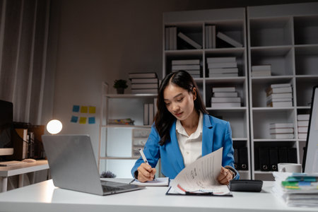 Business woman working in a startup company, female accountant working in auditing the company's accounts and finances, accounting and finance. Accounting and financial auditing concepts.の写真素材