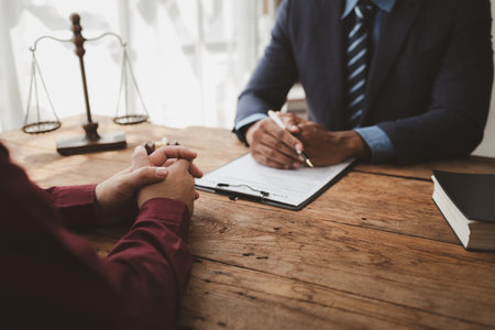 The Human Resources Department is interviewing candidates for the desired position, Discussing previous job experiences with the interviewer, Submit a resume for the company because want the job.の写真素材