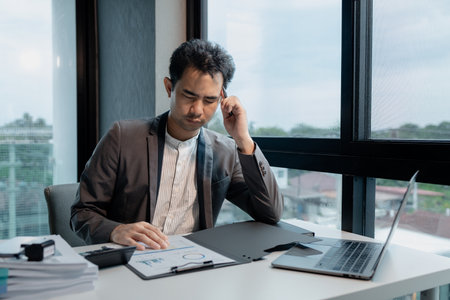 Entrepreneur is getting tired of their work,  Businessman is stressed about managing a startup company, Company employees are stressed because their laptops are having problems, stress idea.の写真素材
