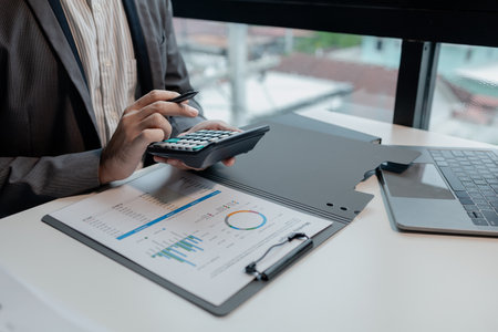 Calculating the currency for account transfer, Currently analyzing investment possibilities, The accountant is checking the financial liquidity of the company, finance idea.の写真素材